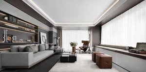Modern living room featuring a grey leather sofa, glass table, and wooden accents.