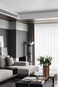 Modern living room with neutral-toned decor and minimalist design.