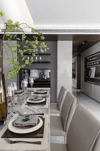 Modern dining room featuring a marble table and bench seating.