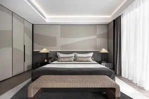 Modern minimalist bedroom with fabric, leather, and metal accents
