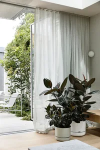 A minimalist modern interior design featuring concrete elements.