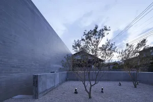 Modern residential space with concrete walls and minimalistic design.