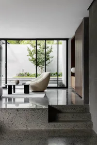 Modern interior space featuring a sleek, minimalist design with concrete as the primary material.