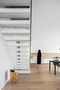 A modern interior designed with minimalist elements and concrete finishes.