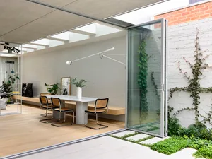 A modern living space featuring concrete structures and furniture.