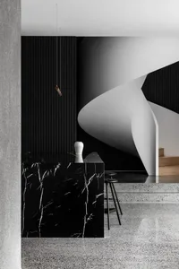 Modern staircase with marble and concrete elements.