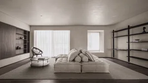 A modern living room featuring neutral-toned leather furniture and minimalist design.