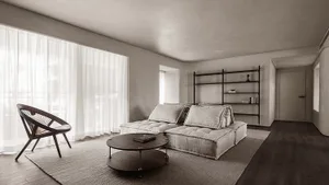 Modern living room with grey furniture, large windows, and a minimalist shelf.