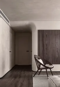 Minimalist living room featuring a wooden chair and beige sofa.