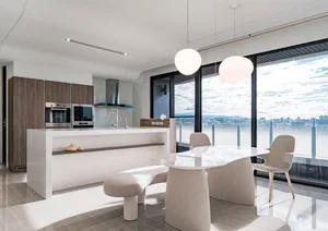 A modern kitchen featuring glass, wood, and white materials.