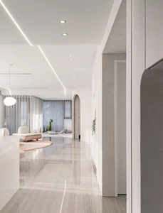 Modern minimalist living room with concrete walls and floor, featuring white furniture and blue light fixtures.