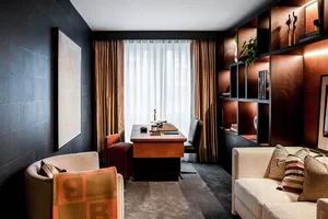 A modern office space featuring wood and leather materials.