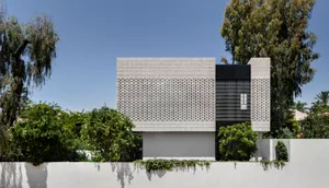 Modern residential building featuring brick cladding and minimalist design
