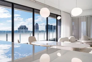 Modern residential penthouse with glass walls and steel accents