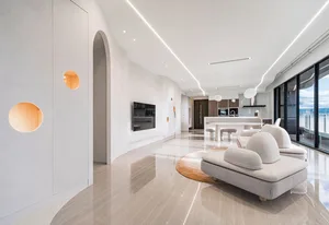 Modern living room featuring marble, concrete, and glass