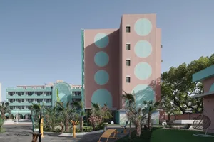 A modern building with concrete and glass exterior materials.