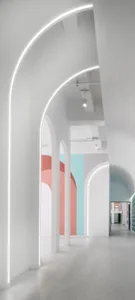 Modern minimalist interior design space with white walls and colorful accents.