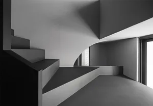 Concrete minimalist architecture photographed in grayscale.
