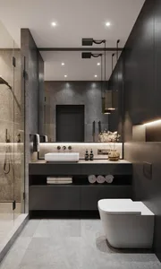 Modern bathroom with stone tile flooring, black metal accents, and a white floating vanity with a vessel sink.