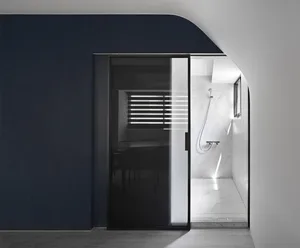 Minimalist modern bathroom with marble walls, glass shower enclosure, and wooden floor.
