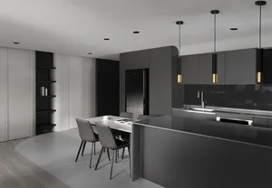 Modern black kitchen design with metallic accents and minimalist style.