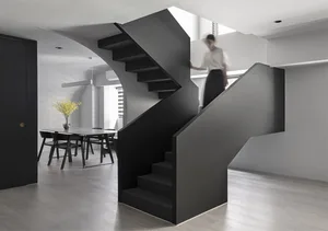 A modern black staircase with a sleek, minimalist design.