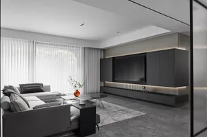 Minimalist living room with steel furniture, marble accents, and glass elements.