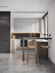 A minimalist residential kitchen featuring concrete countertops and bar stools.