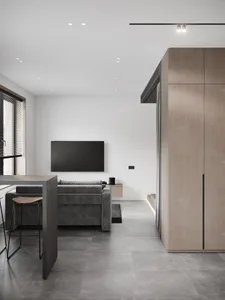 A modern living room with metallic finishes and minimalist design