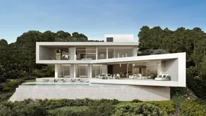 A modern house with a glass exterior and a swimming pool surrounded by greenery.
