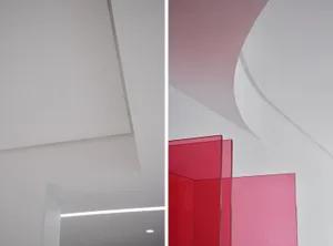 Modern interior design featuring distinct red glass panels.