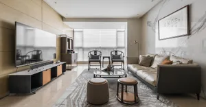 Modern living room featuring marble and leather furniture, minimalist design, and a sleek, polished aesthetic.