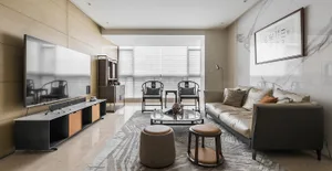 Modern living room with marble accents, leather sofa, and wooden furniture.