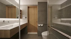 A modern minimalist bathroom with concrete walls and flooring, featuring a sleek sink and toilet design.