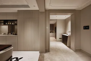 A modern dining room featuring marble and wood elements.