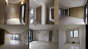 A modern interior space featuring marble flooring and minimalist design elements.