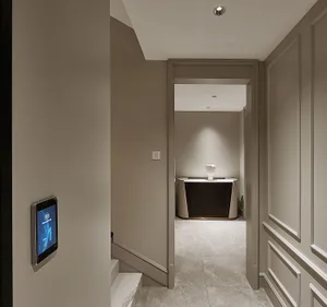 Modern corridor with marble flooring and walls.