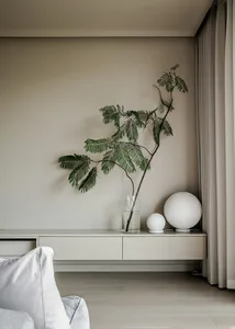 A modern living room with floating shelves, a green plant, and spherical lamps.