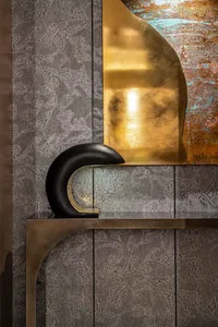Modern console table with metal frame and leather top.