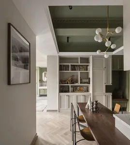 A modern interior design featuring a dining room and library with mixed materials and a herringbone wooden floor.