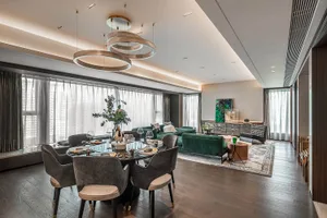 An elegantly designed living and dining room with modern furniture and decor.