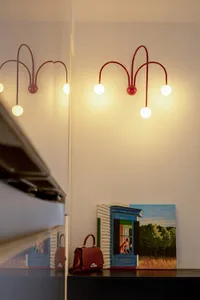 A modern interior featuring decorative lighting with metal arms.