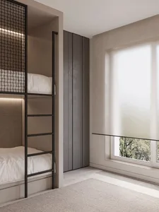 Modern minimalist bedroom with black frame bunk beds and a large window.