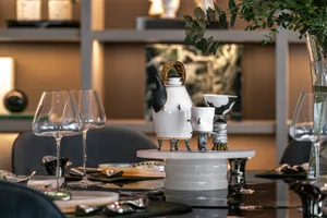 A modern, industrial setting featuring ceramic objects on a table.