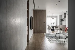 Modern living room with wooden flooring, furniture, and decor.