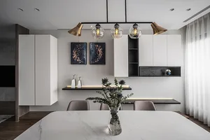 Minimalist modern dining room with white table, black shelving, and wood accents