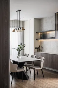 Modern kitchen featuring marble countertops and minimalist design.