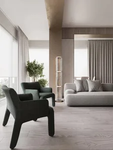 A modern living room featuring fabric furniture, glass accents, and wooden elements.