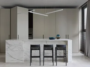 Modern kitchen with marble countertops and glass elements