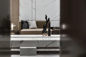 A modern living room featuring marble elements and contemporary decor.